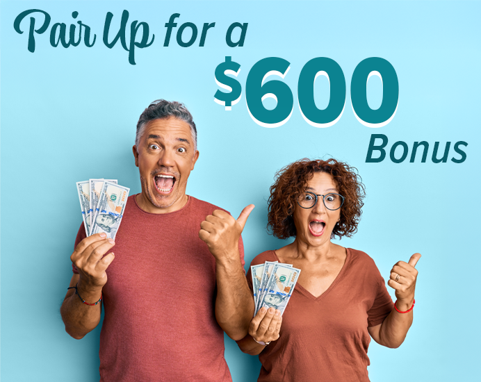 Excited Couple Holding $600