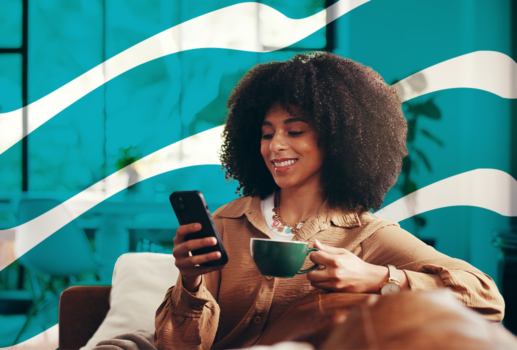 Woman drinking coffee on couch