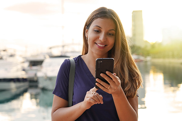 woman looking at apps on phone